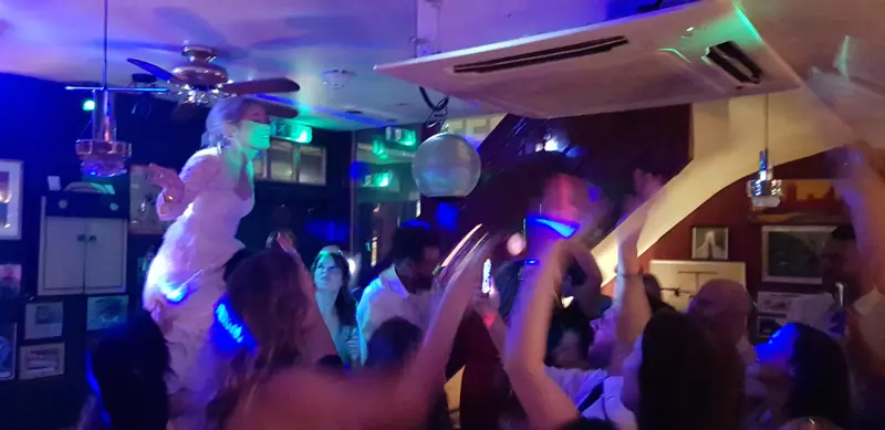 Bride lifted on the dance floor